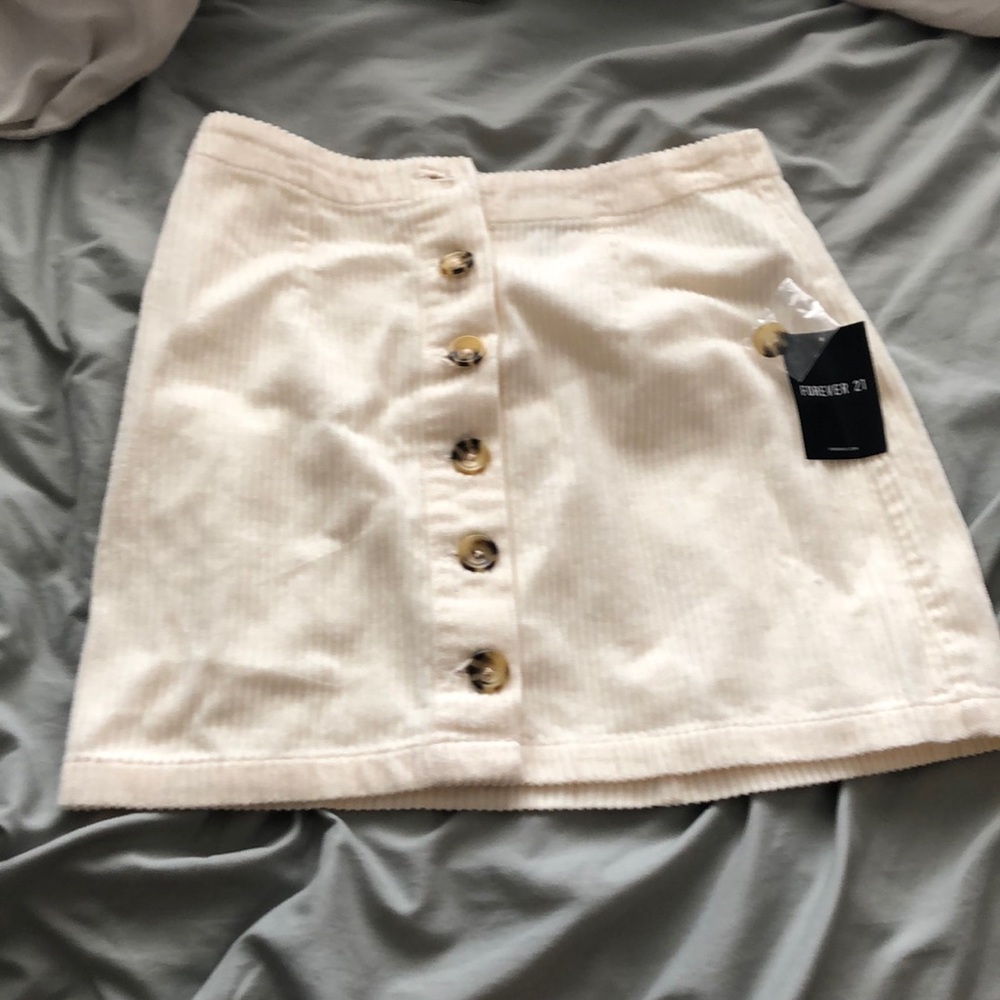 Cream colored mini button-up skirt